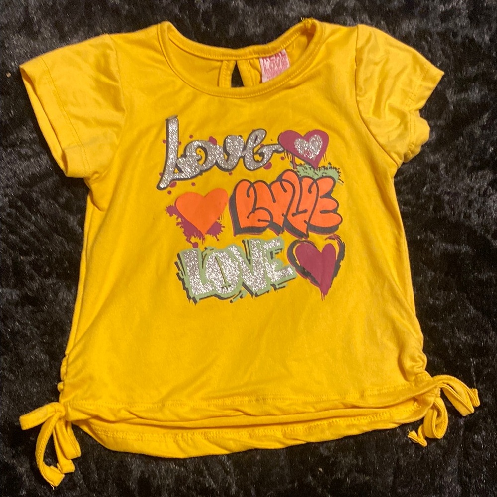 Vibrant Yellow Tee with Playful Graphic and Tie Details